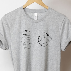 May include: A gray t-shirt with a black graphic of two hands making the ASL sign for "I love you".