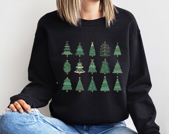 May include: Black sweatshirt with a festive design of 18 green Christmas trees with gold ornaments and lights.