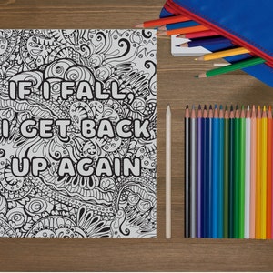 May include: A black and white coloring page with a motivational quote: "If I fall, I get back up again." The quote is surrounded by intricate floral designs.