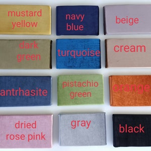 May include: A color chart with 12 fabric swatches in various colors, including mustard yellow, navy blue, beige, dark green, turquoise, cream, anthracite, pistachio green, orange, dried rose pink, gray, and black.