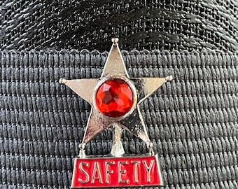 Pin de solapa con estrella de seguridad roja