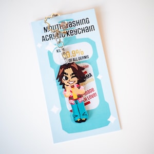 May include: Acrylic keychain featuring a cartoon character in a Hawaiian shirt and blue pants. The keychain is attached to a light blue card with text that reads "MOUTHWASHING ACRYLIC KEYCHAIN" and "KILLS 99.9% OF ALL GERMS".