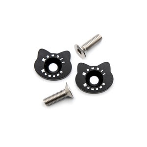 May include: Four black cat-shaped metal pieces with the text "KUMOWO" in white, and two silver screws. The cat-shaped pieces have a circular hole in the center. The screws have a hexagonal head.
