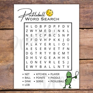 May include: A printable pickleball word search puzzle featuring a yellow pickleball and a cartoon pickle holding a paddle. The words to find are: net, kitchen, player, ball, points, paddle, dink, serve, and pickleball.