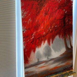 May include: A painting of a red tree in a foggy forest. The tree is in the foreground and the fog is in the background. The painting is signed "Jurica Tomic 2017".