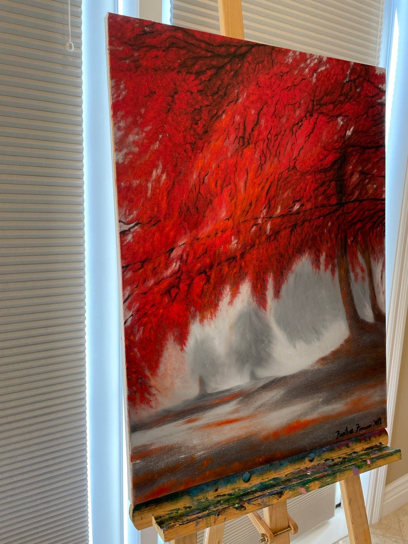 May include: A painting of a red tree in a foggy forest. The tree is in the foreground and the fog is in the background. The painting is signed "Jurica Tomic 2017".