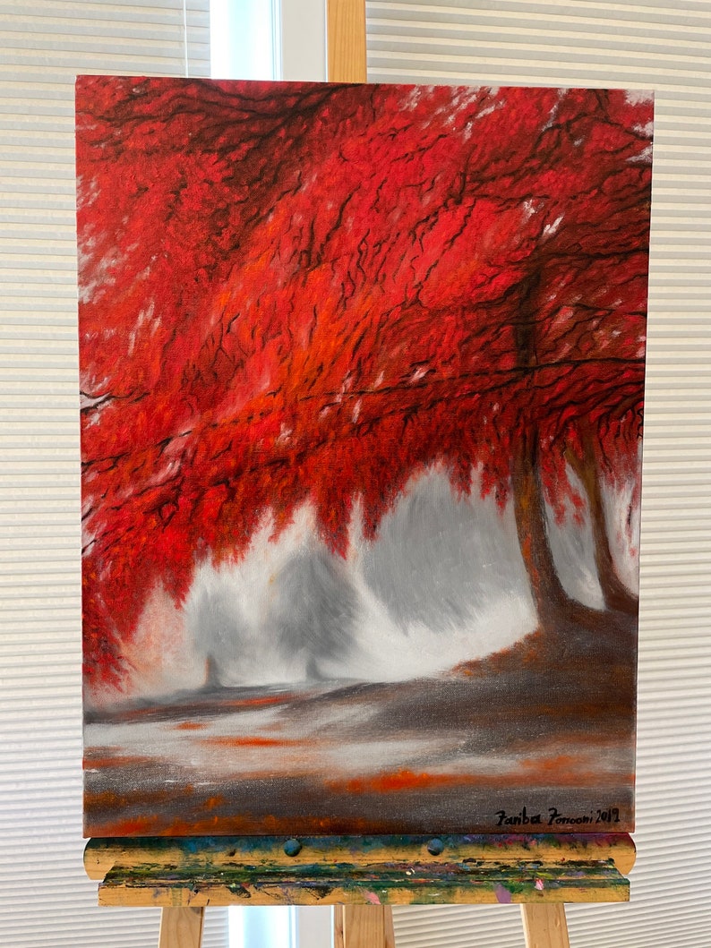 May include: A painting of a red tree in a foggy forest. The tree is in the foreground and the fog is in the background. The painting is signed "Fanba Pomoni 2012".