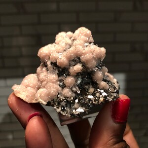 Rhodochrosite on arsenopyrite, Kosovo.