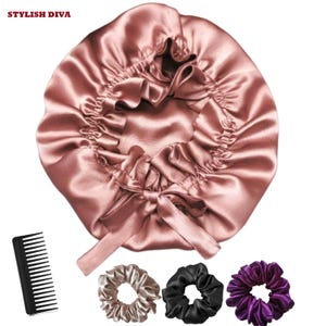 May include: A satin bonnet in a dusty rose color, with a matching ribbon tie, a black comb, and three scrunchies in gold, black, and purple. The text "STYLISH DIVA" is at the top.
