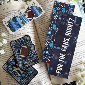 May include: A collection of football-themed bookmarks and cards. The bookmarks feature text like "FOR THE FANS, RIGHT?" and "FOR THE FANS" with football and leaf designs. The cards have football graphics and the names "KYRAN HARBOR" and "AVI VEGA".