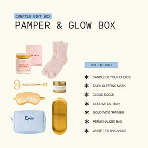 The image is a curated gift box containing various beauty and personal care items, including a candle, a pair of fuzzy socks, a satin sleeping mask, a pair of gold metal trays, a gold wick trimmer, a personalized bag, and a white tea candle.