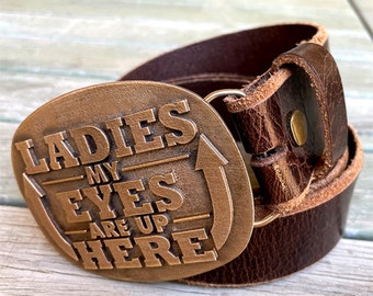 Western wear belt buckle in bronze, "Ladies, My Eyes Are Up Here"