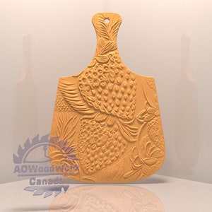 May include: A wooden cutting board with a carved design of strawberries. The board has a handle and is made of light brown wood.