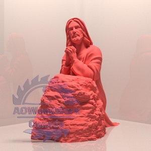 May include: A red 3D printed statue of Jesus kneeling in prayer on a rock. The statue is made of a smooth, solid material and has a realistic appearance.