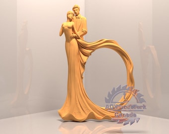 May include: A wooden sculpture of a bride and groom standing together. The bride is wearing a flowing gown and the groom is wearing a suit. The sculpture is painted in a light brown color and has a smooth finish. The sculpture is on a white background.
