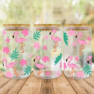 May include: Three clear plastic tumblers with bamboo lids and straws. Each tumbler features a pink flamingo and tropical leaf pattern.