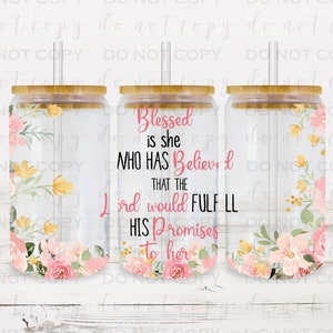 May include: Three clear glass tumblers with bamboo lids and straws. The tumblers are decorated with pink and yellow floral designs. The middle tumbler has the text "Blessed is she who has believed that the Lord would fulfill his promises to her".