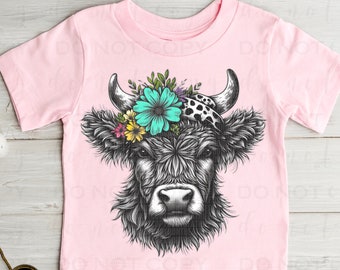 May include: A pink t-shirt with a black and white illustration of a cow's head with a floral crown. The flowers are pink, yellow, blue, and green.