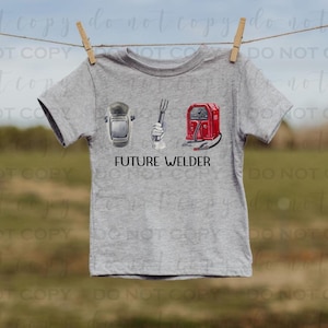 May include: A gray t-shirt with a graphic of a welding helmet, a wrench, and a welding torch. The text "FUTURE WELDER" is printed below the graphic.