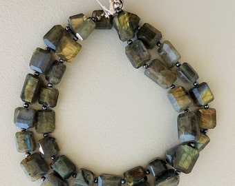 May include: A double-strand necklace made of dark green labradorite gemstone beads with a silver clasp.