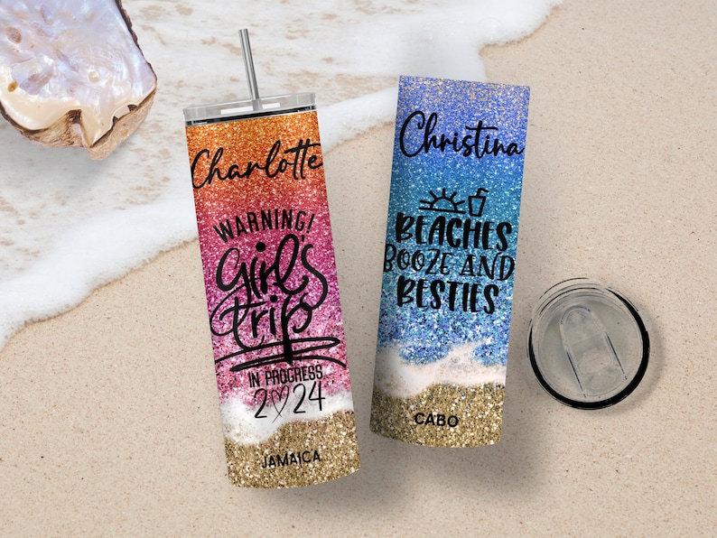 May include: Two personalized stainless steel tumblers with glitter designs. One tumbler is pink and orange with the text "Charlotte Warning! Girl's Trip In Progress 2024 Jamaica". The other tumbler is blue and white with the text "Christina Beaches Booze and Besties Cabo".