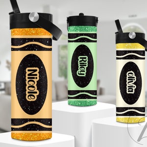 May include: Three personalized water bottles with a crayon design. The bottles are yellow, green, and white with black glitter accents. The names "Nicole", "Riley", and "Olivia" are printed on the bottles.