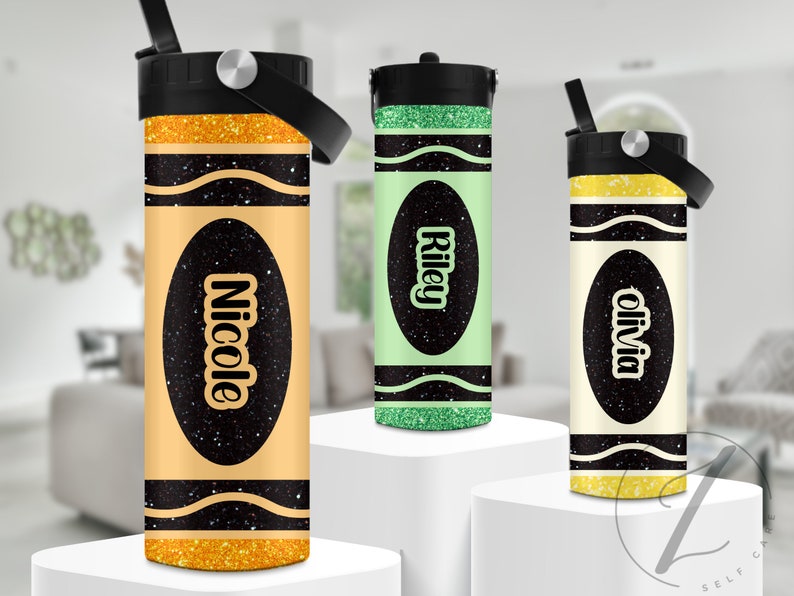 May include: Three personalized water bottles with a crayon design. The bottles are yellow, green, and white with black glitter accents. The names "Nicole", "Riley", and "Olivia" are printed on the bottles.