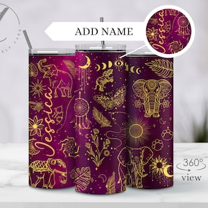 May include: A set of three purple and gold tumblers with a bohemian design featuring elephants, dreamcatchers, butterflies, moons, and stars. The tumblers are personalized with the name "Jessica".