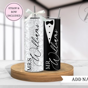 May include: Two stainless steel tumblers with a white and black design. The tumbler on the left has a white background with a lace pattern and the text "MRS Williams". The tumbler on the right has a black background with a tuxedo design and the text "MR Williams".
