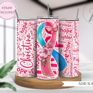 May include: A pink and blue tumbler with a pink ribbon and butterfly design. The tumbler is covered in the words "Survivor", "Hope", and "Fighter".