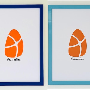 May include: Two framed art prints. One has a navy blue frame, the other a light blue frame. Each features an orange egg-shaped design with white lines and the text "FramesDen" in black script.