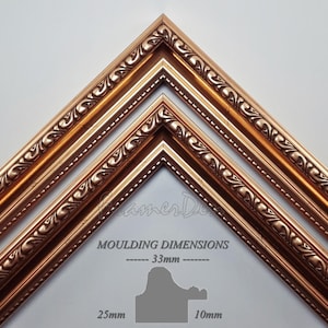 May include: Three ornate picture frames in a gold finish, stacked on top of each other. The frames have a decorative, intricate design with a beaded edge. The frame dimensions are listed as 33mm, 25mm, and 10mm.