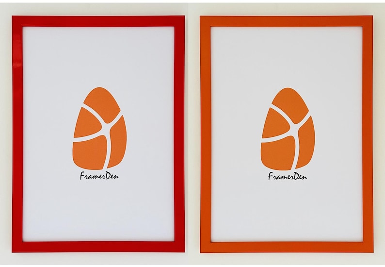 May include: Two framed prints with a white background and an orange egg-shaped design. The frames are red and orange, and the text "FramesDen" is at the bottom of each print.