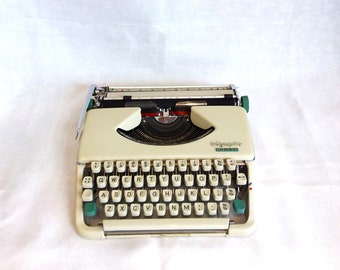 Olympia Splendid 66, vintage typewriter, 1964. cream with green tabs, portable QWERTY typewriter.