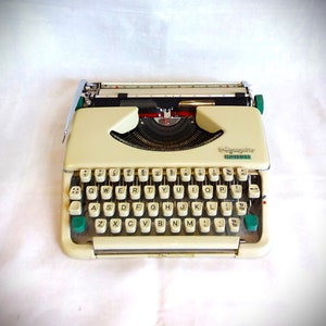 Olympia Splendid 66, vintage typewriter, 1964. cream with green tabs, portable QWERTY typewriter.
