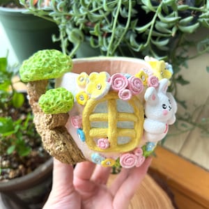Handmade and hand painted succulent planter pot with Cute rabbit and flowers banyan tree house shape