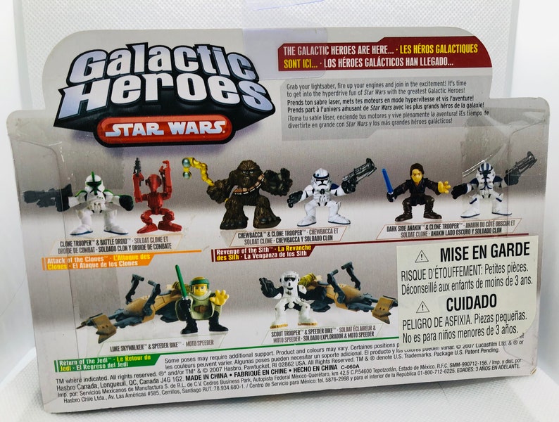May include: A set of Star Wars Galactic Heroes action figures. The figures include Chewbacca, a Clone Trooper, a Dark Anakin, and a Speeder Bike. The packaging features the Star Wars logo and the Galactic Heroes logo.