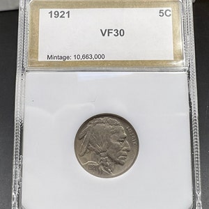 May include: A 1921 Buffalo nickel coin graded VF30 in a plastic coin holder. The coin has a mintage of 10,663,000.