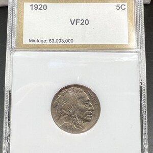 May include: A 1920 5c Buffalo nickel coin graded VF20 in a plastic slab with a white background. The coin has a mintage of 63,093,000.