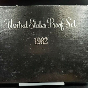 May include: A black box with the text "United States Proof Set 1982" in silver lettering.