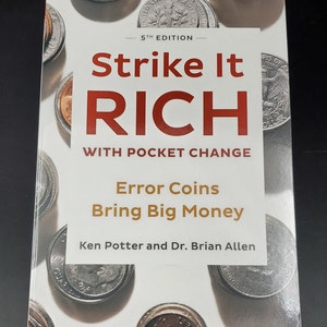 May include: A white book with the title "Strike It Rich" in red letters. The subtitle is "With Pocket Change" in black letters. The book cover features a pattern of silver coins with the text "Error Coins Bring Big Money" in gold letters. The author's names are "Ken Potter and Dr. Brian Allen" in black letters.