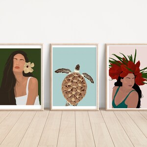 May include: Three framed illustrations. The first features a woman with long dark hair and a flower behind her ear. The second features a sea turtle with a brown shell on a light blue background. The third features a woman with a red flower crown on a pink background.