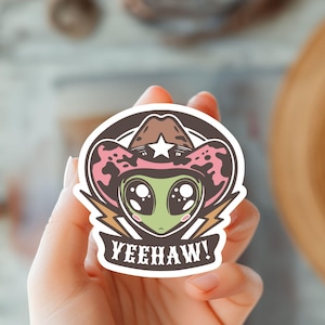 Sticker extraterrestre Yeehaw - Design extraterrestre western amusant - Cowboy de l'espace rétro - Art extraterrestre mignon - déco ovni - Art extraterrestre amusant - Art sur le thème des extraterrestres