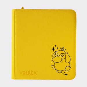May include: A bright yellow card binder with a black cartoon duck illustration and the word "vaultx" printed on the front. The binder has a zipper closure and is designed to hold trading cards.