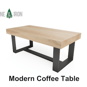 May include: Modern coffee table with a light wood top and black metal legs. The table is made by Pine & Iron.