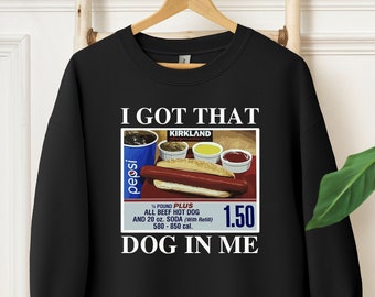 May include: Black sweatshirt with a white graphic of a hot dog and soda combo meal with the text "I GOT THAT DOG IN ME" and the price "1.50".