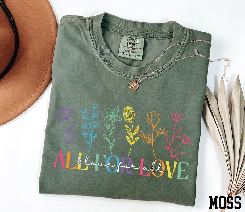 a t - shirt that says all you need is love and flowers