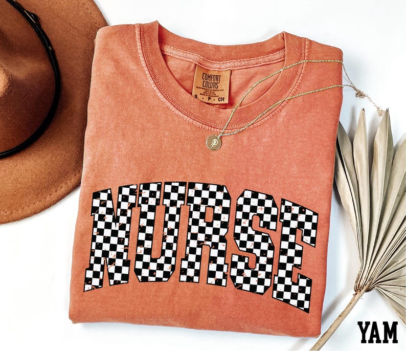a red t-shirt with the word "NURSE" printed on it, along with a brown hat and a fan.