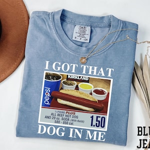 a blue shirt with a picture of a hot dog and mustard