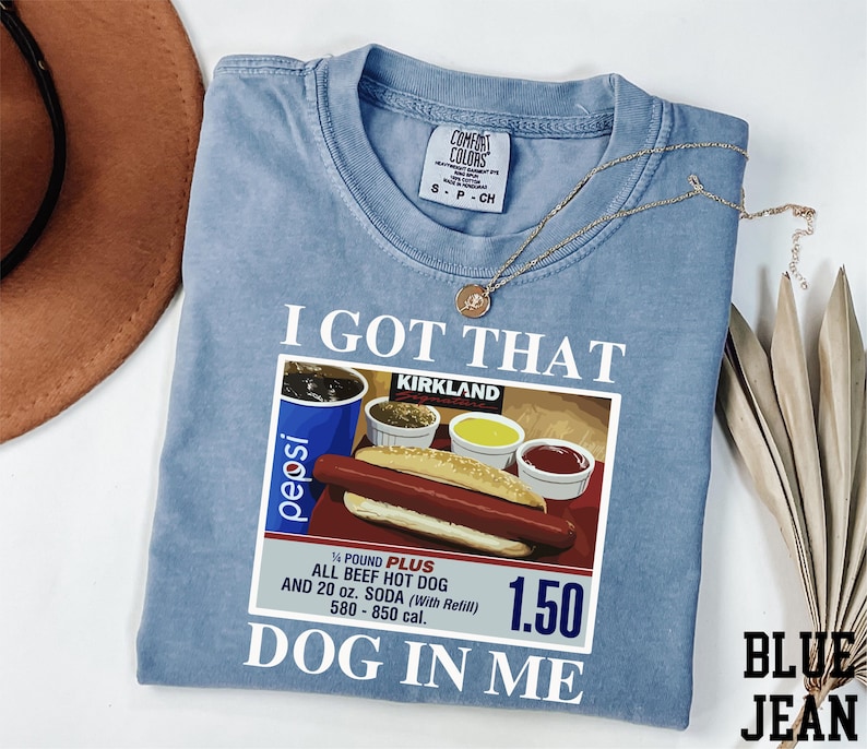 a blue shirt with a picture of a hot dog and mustard